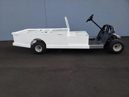 YAM-DRIVE-ST-FLAT-72 YAMAHA DRIVE CART STRETCH INTO STEEL 6′ FLATBED in white custom fabrication for golf carts designed for cargo and utility transport.