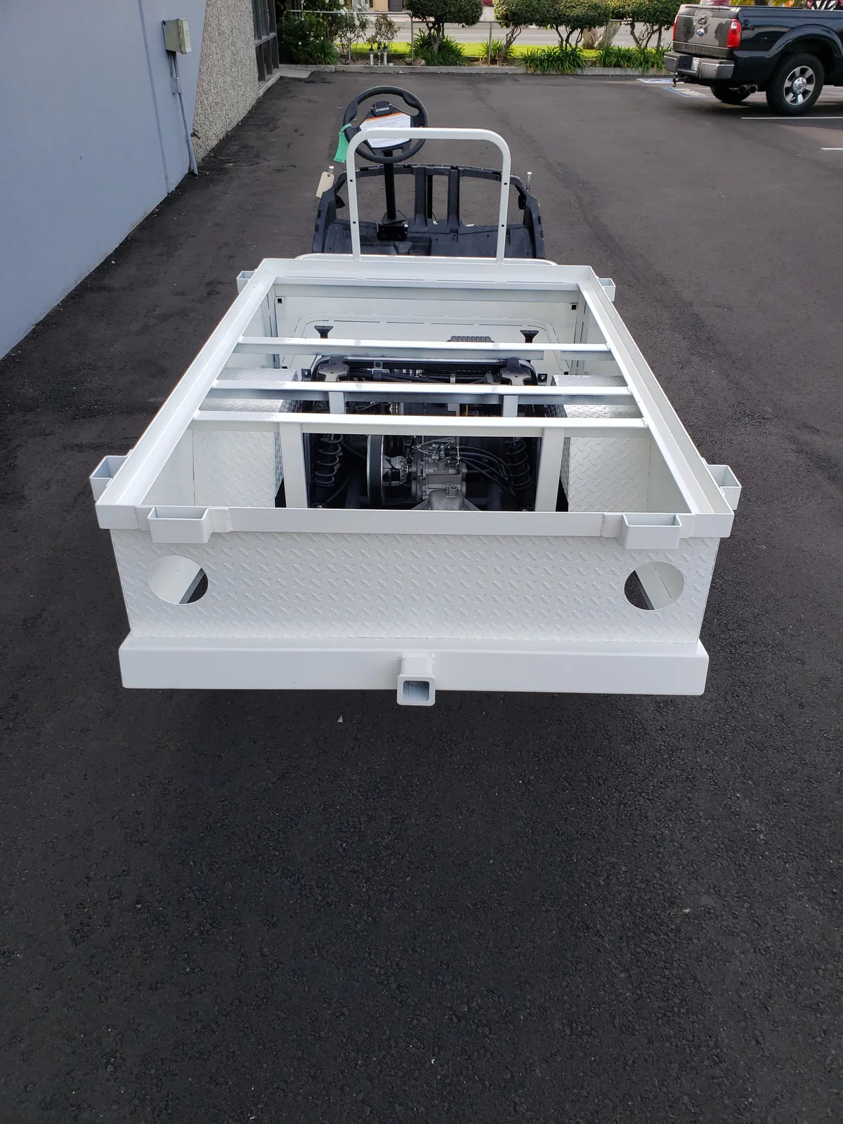 White metal frame mounted on a golf cart designed for flatbed deck conversion, highlighting the STAKEBED POCKETS FOR 6 FT FLATBED DECK CONVERSION with custom fabrication for golf carts.