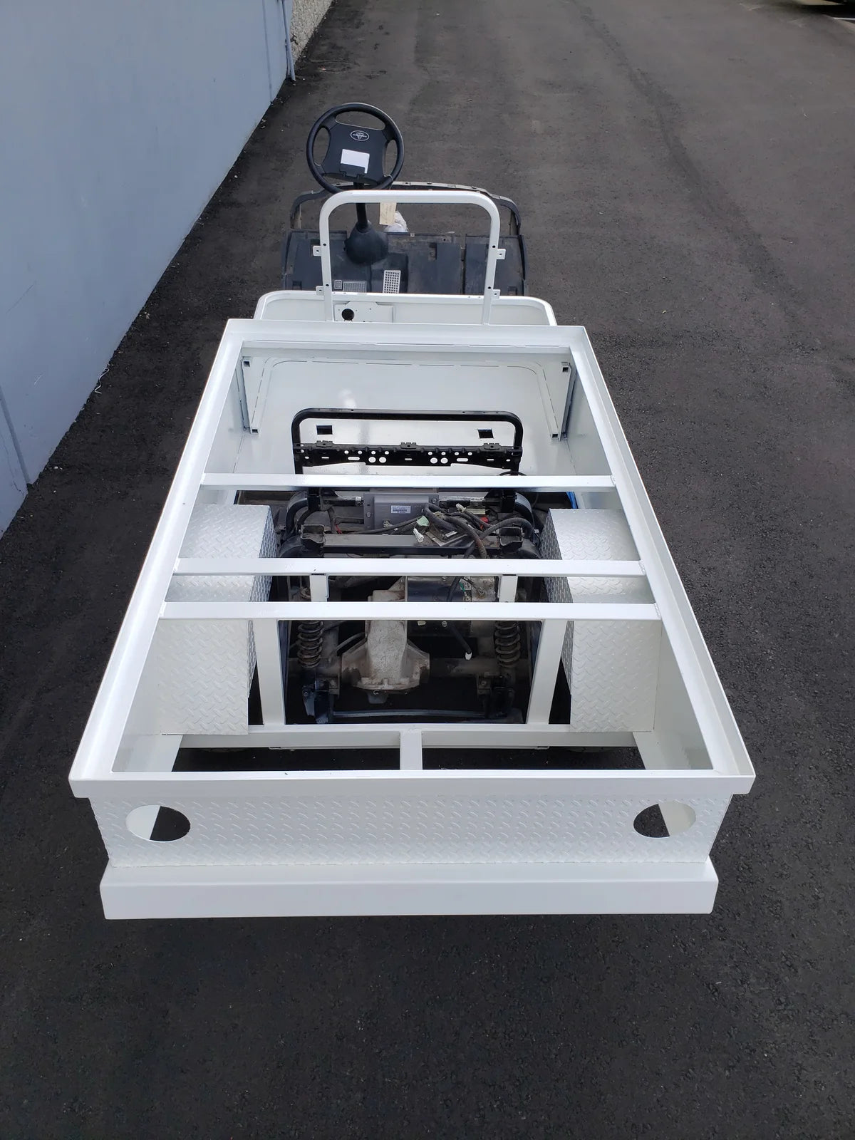 YAM-DRIVE-ST-FLAT-72 YAMAHA DRIVE CART STRETCH INTO STEEL 6′ FLATBED featuring a durable custom fabrication for golf carts with steel flatbed and open cargo area for utility use.