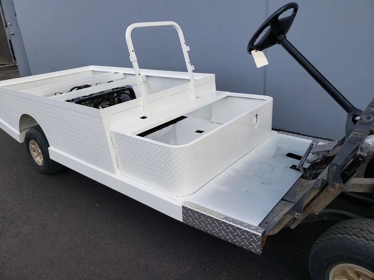 YAM-DRIVE-ST-FLAT-72 YAMAHA DRIVE CART STRETCH INTO STEEL 6′ FLATBED with custom fabrication for golf carts, featuring a sturdy white steel flatbed and reinforced cargo area.