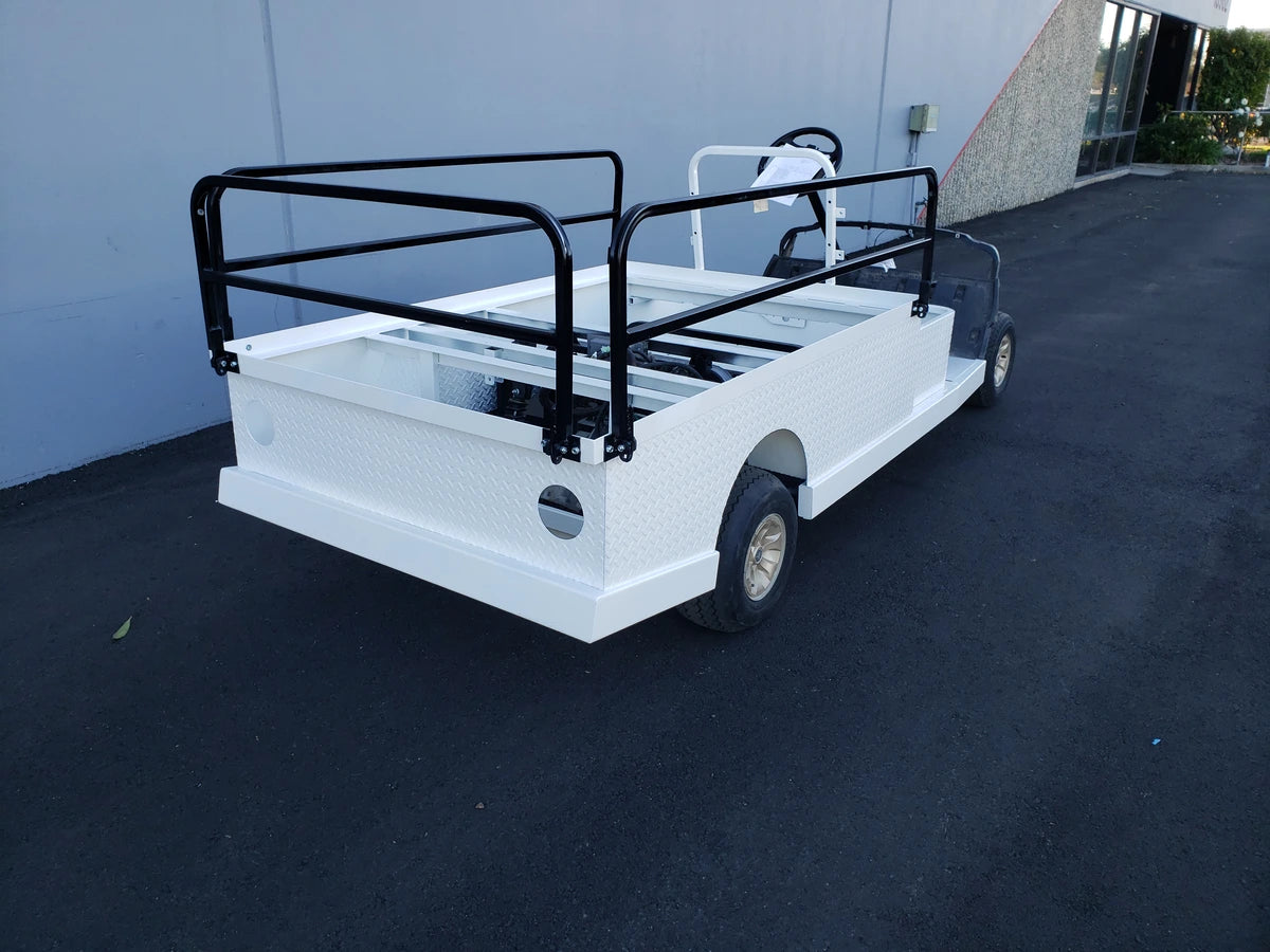DROP RAILS 44″ X 72″ X 18″ FLATBED SIDE RAILS FOR 6 FT FLATBED CONVERSION installed on a golf cart flatbed, showcasing custom fabrication for golf carts with black metal side rails and white flatbed cargo area.