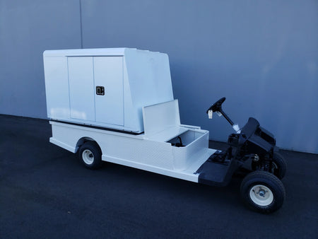 EZGO-RXV-ST-FLAT-72 EZ GO RXV FLATBED RETROFIT CONVERSION with a custom fabricated flatbed and utility box installed on a golf cart for cargo and specialty use.