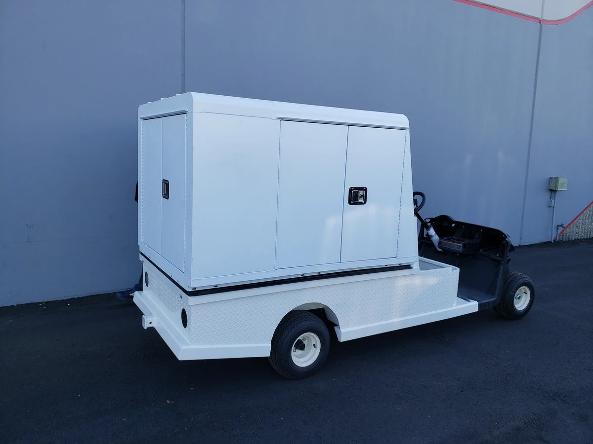 EZGO-RXV-ST-FLAT-72 EZ GO RXV FLATBED RETROFIT CONVERSION golf cart featuring a custom fabrication flatbed with white cargo enclosure for utility and specialty golf cart beds.