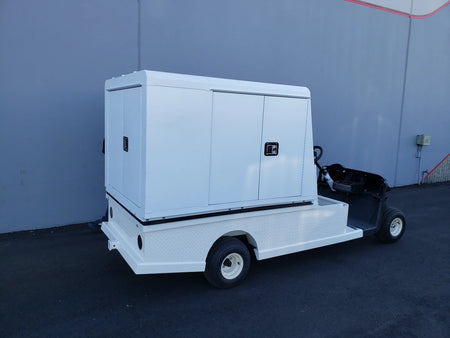 EZGO-RXV-ST-FLAT-72 EZ GO RXV FLATBED RETROFIT CONVERSION golf cart featuring a custom fabrication flatbed with white cargo enclosure for utility and specialty golf cart beds.