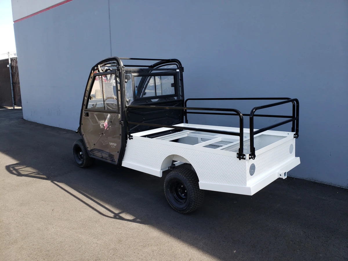 CUSH-800-ST-FLAT-72 CUSHMAN HAULER 800 CART STRETCHED INTO 6′ FLATBED with black cab and custom white flatbed, designed for utility cargo and custom fabrication for golf carts.