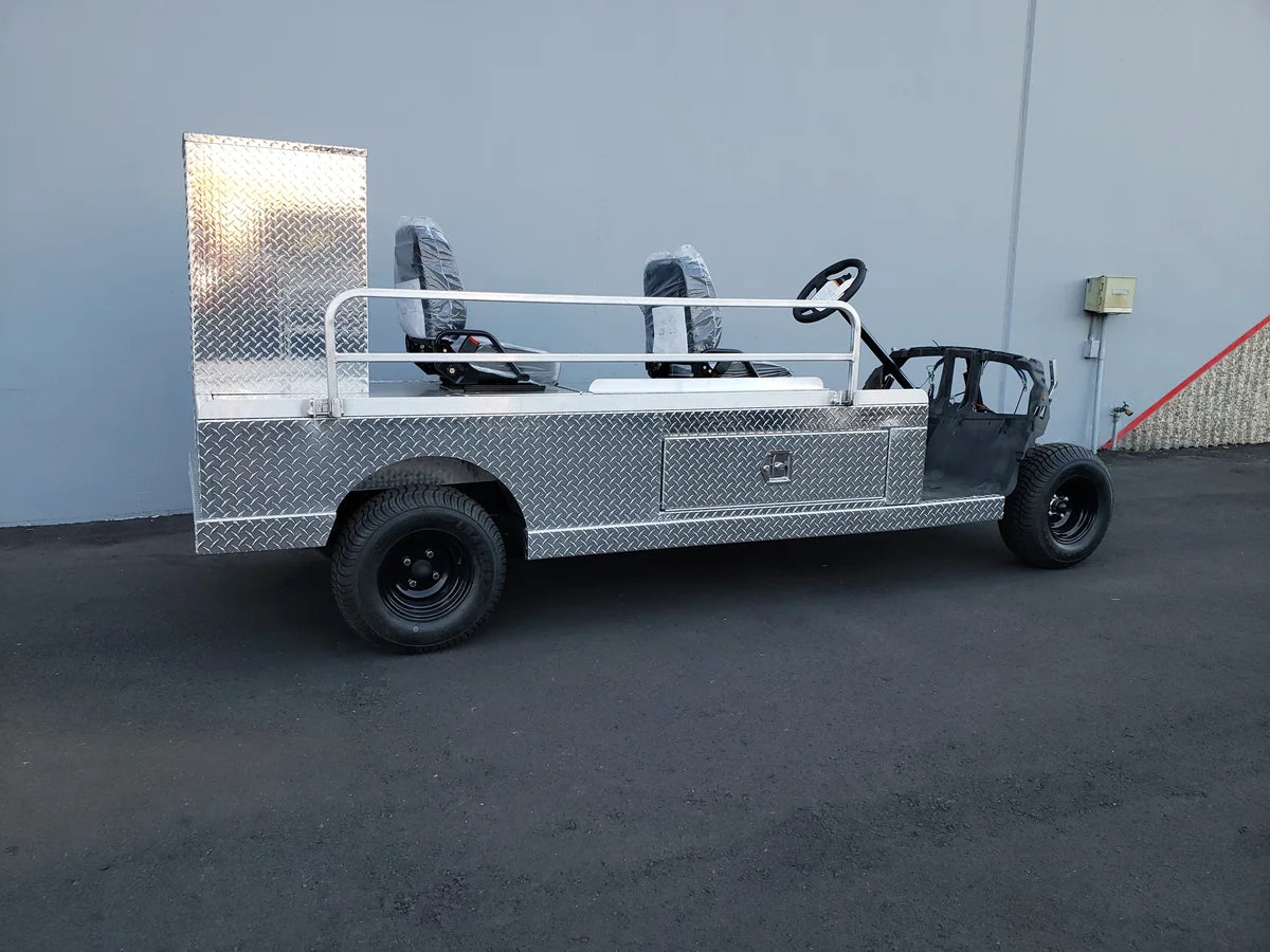 YAM-AMB-96X23 AMBULANCE CART CONVERSION FOR YAMAHA GOLF CART showing custom fabrication with diamond plate aluminum body, open seating, and utility compartments designed for golf cart ambulance use.