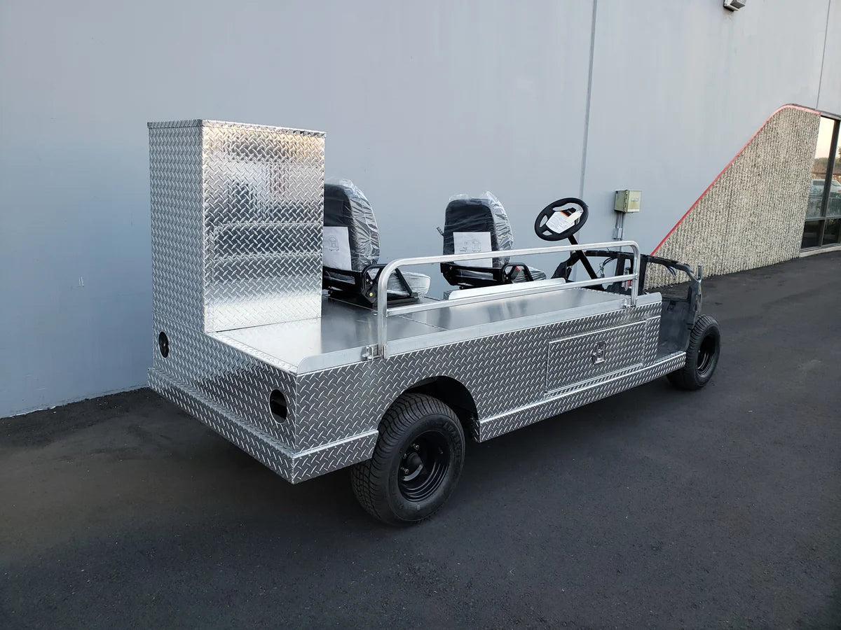 YAM-AMB-96X23 AMBULANCE CART CONVERSION FOR YAMAHA GOLF CART with custom fabrication featuring diamond plate metal, utility boxes, and seating for emergency transport.