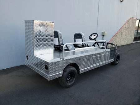 YAM-AMB-96X23 AMBULANCE CART CONVERSION FOR YAMAHA GOLF CART with custom fabrication featuring diamond plate metal, utility boxes, and seating for emergency transport.