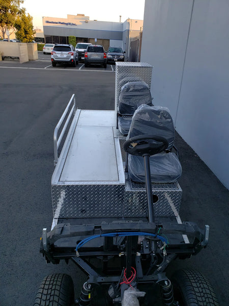 YAM-AMB-96X23 AMBULANCE CART CONVERSION FOR YAMAHA GOLF CART featuring custom fabrication with aluminum diamond plate panels, dual seats, and a flatbed utility area for medical transport or equipment.