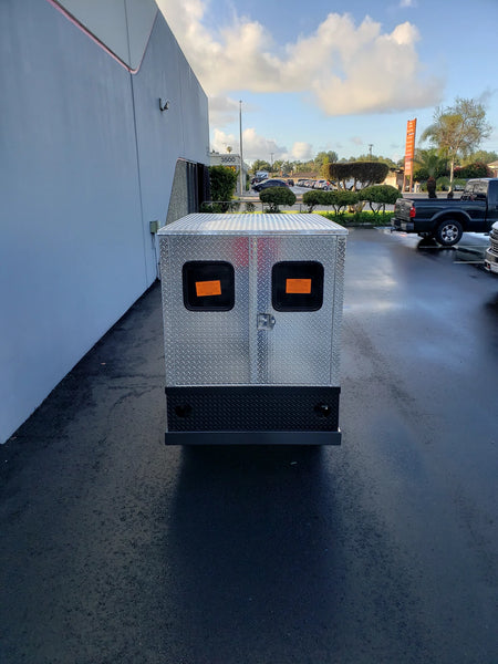 FMB-44X72X48-D-D2W2 FLATBED ALUMINUM DIAMOND PLATE MULTI-PURPOSE BOX 44″ WIDE X 72″ LONG X 48″ TALL WITH LOCKING DOORS outdoor view showing durable flatbed utility box designed for custom fabrication for golf carts.