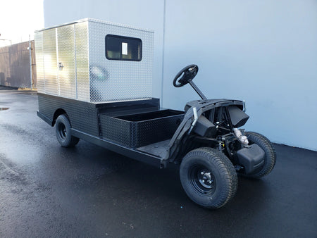 Golf cart featuring a custom fabrication with FMB-44X72X48-D-D2W2 FLATBED ALUMINUM DIAMOND PLATE MULTI-PURPOSE BOX 44″ WIDE X 72″ LONG X 48″ TALL WITH LOCKING DOORS mounted on the rear.