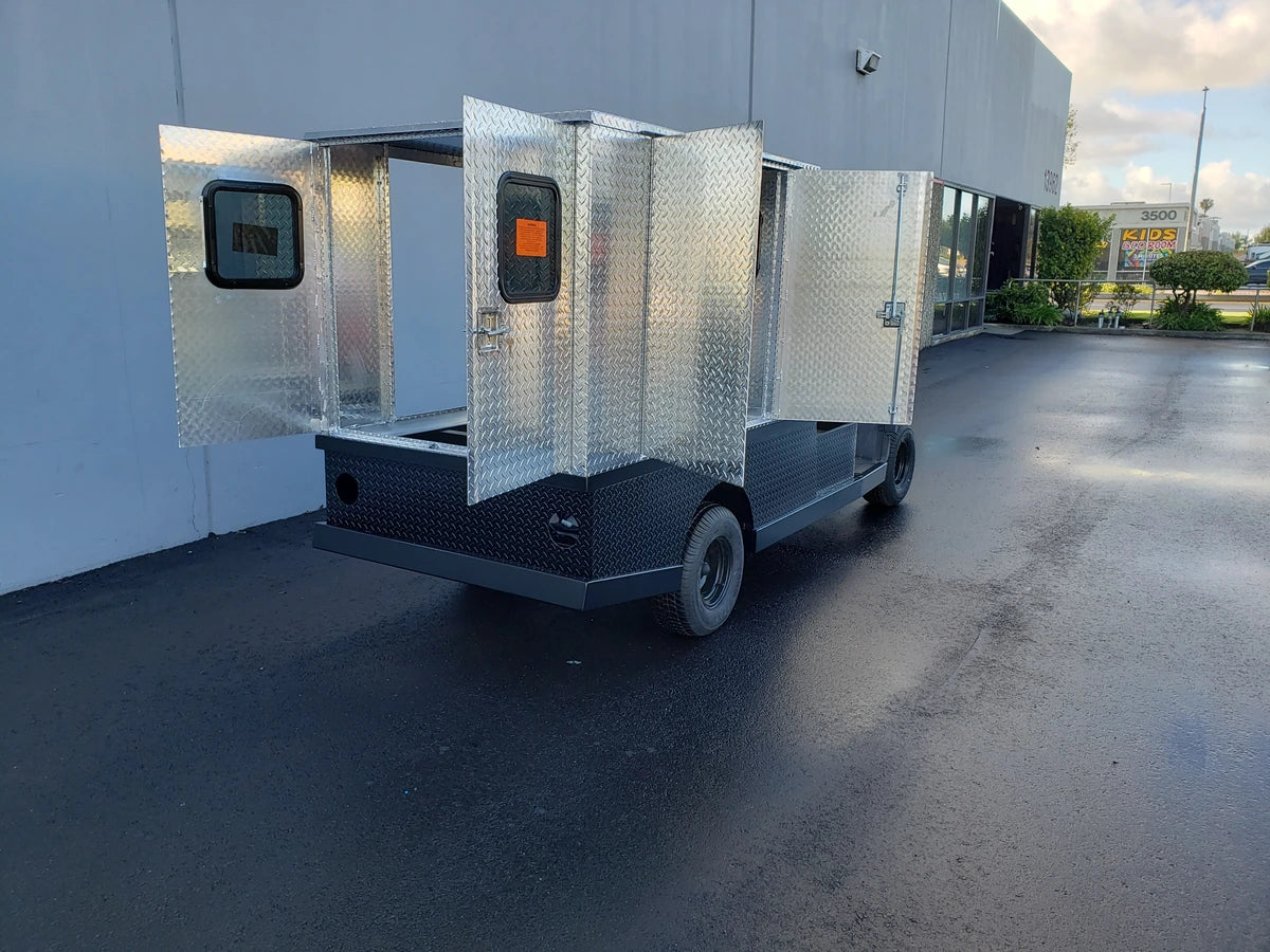 FMB-44X72X48-D-D2W2 FLATBED ALUMINUM DIAMOND PLATE MULTI-PURPOSE BOX 44″ WIDE X 72″ LONG X 48″ TALL WITH LOCKING DOORS mounted on a utility vehicle, custom fabrication for golf carts.