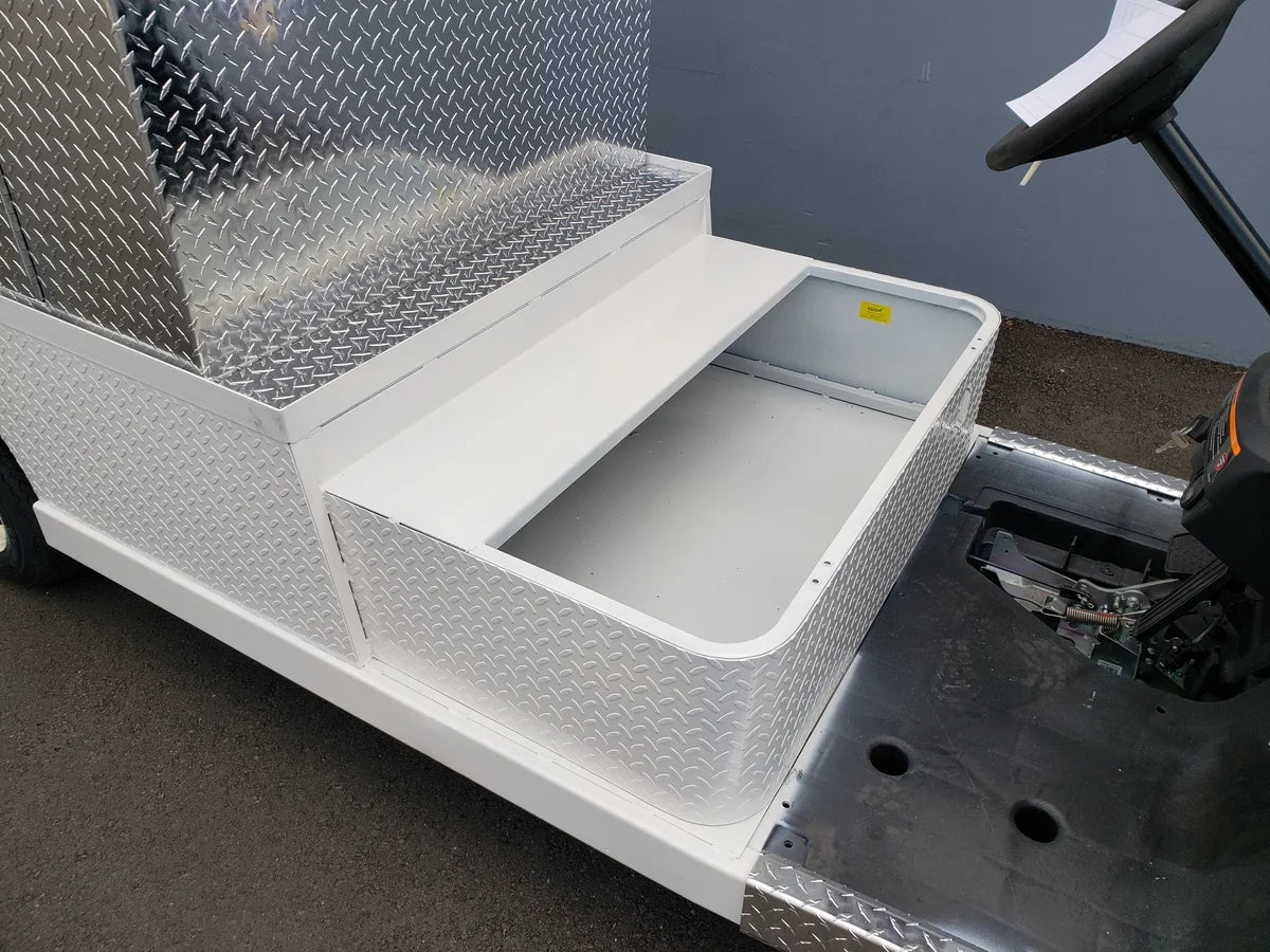 FMB-44X72X48-S-D3W0 FLATBED ALUMINUM SMOOTH MULTI-PURPOSE BOX 44″ WIDE X 72″ LONG X 48″ TALL WITH LOCKING DOORS custom fabricated for golf carts, featuring a durable aluminum flatbed utility box for cargo and accessories.
