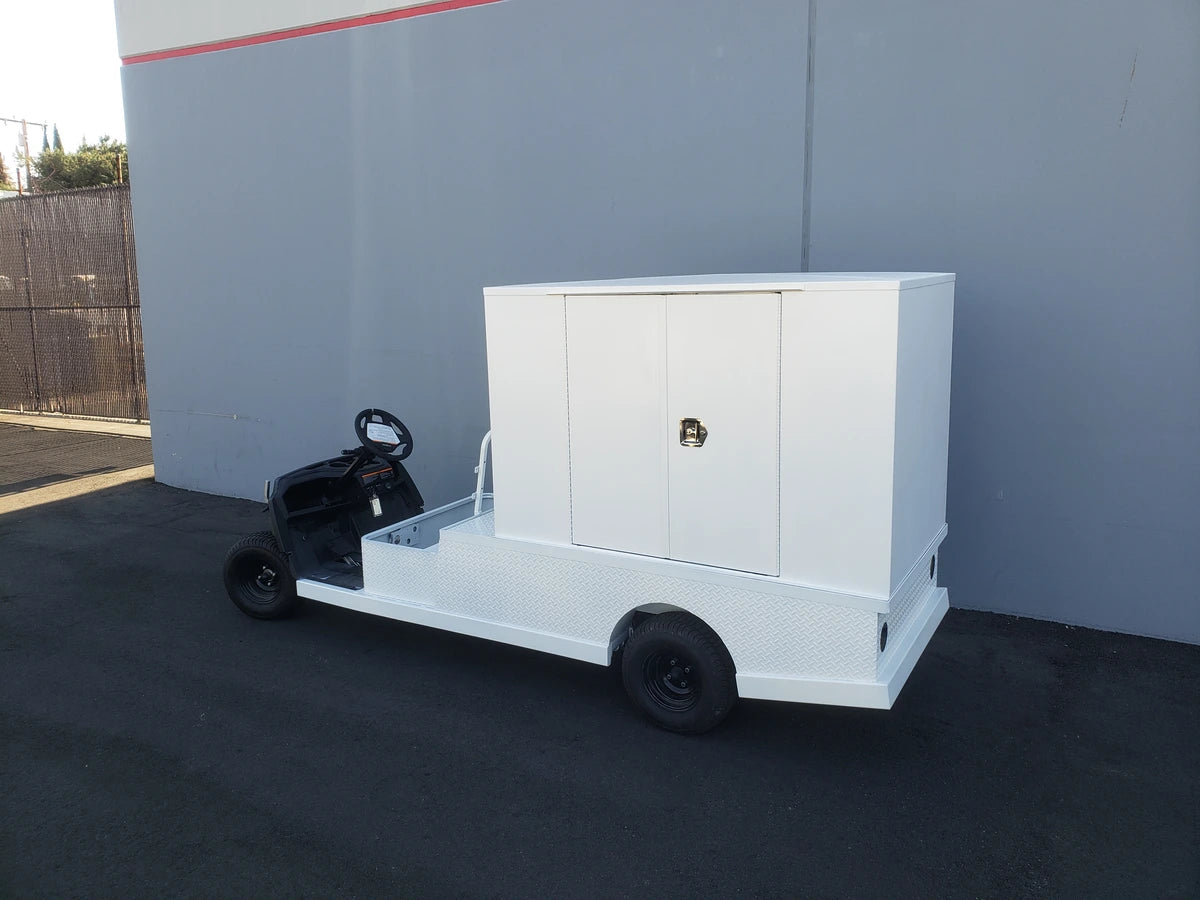 FMB-44X72X48-D-D2W0 FLATBED ALUMINUM DIAMOND PLATE MULTI-PURPOSE BOX mounted on a custom white flatbed golf cart designed for versatile cargo and utility use.