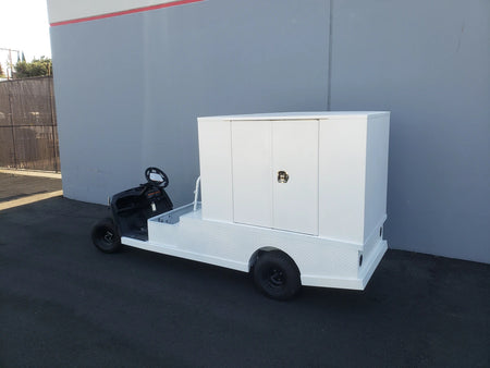 FMB-44X72X48-D-D2W0 FLATBED ALUMINUM DIAMOND PLATE MULTI-PURPOSE BOX mounted on a custom white flatbed golf cart designed for versatile cargo and utility use.