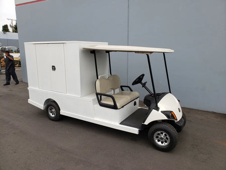 Golf cart equipped with FMB-44X72X48-S-D2W0 FLATBED ALUMINUM SMOOTH MULTI-PURPOSE BOX for custom fabrication, ideal for cargo and utility transport.