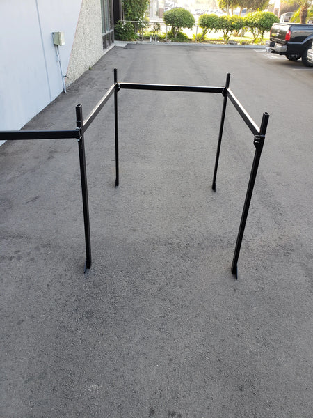 FB-45X72-TLR TOP MOUNT LADDER RACK FOR FLATBED shown standing on pavement, designed with sturdy metal frame ideal for custom fabrication for golf carts, cargo, and utility applications.