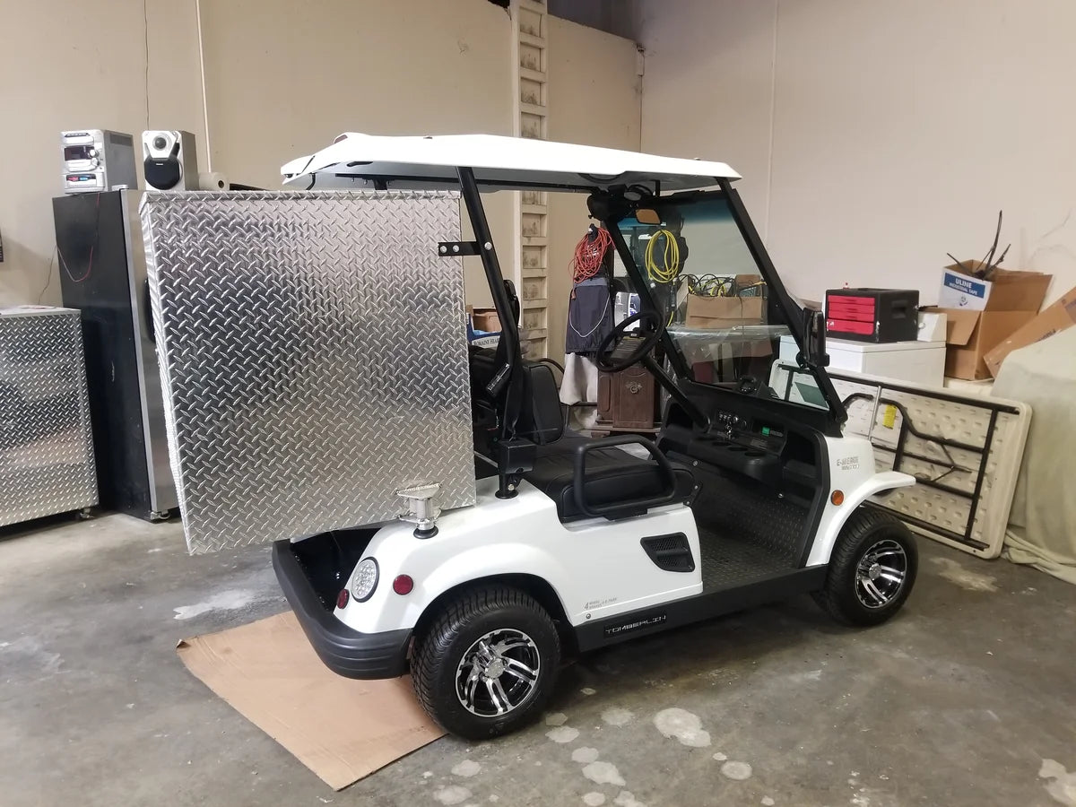 White golf cart fitted with a custom fabrication TOM-35X32X37-RB Tomberlin Emerge Rear Box in diamond plate aluminum, designed for cargo and utility use with specialized racks.