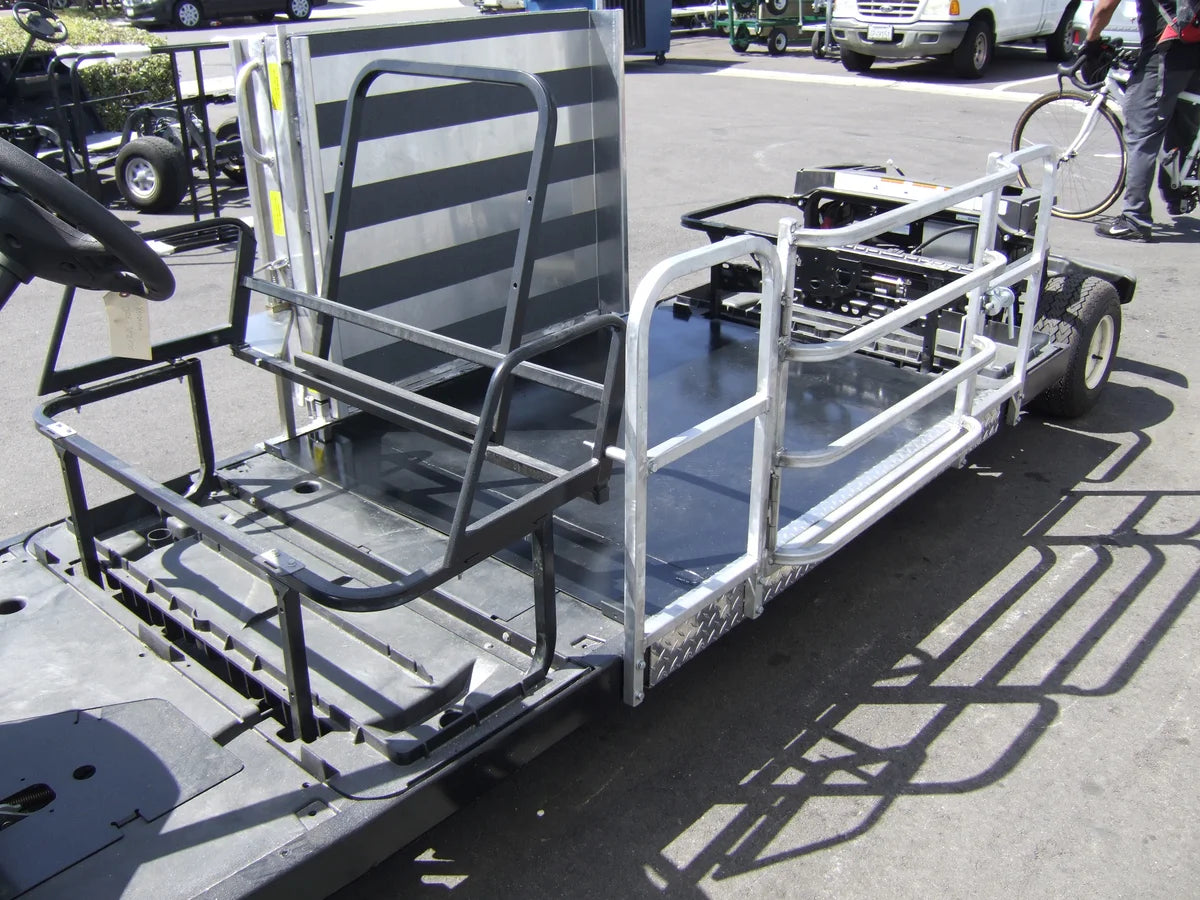 Metallic flatbed trailer with striped seat on a street
