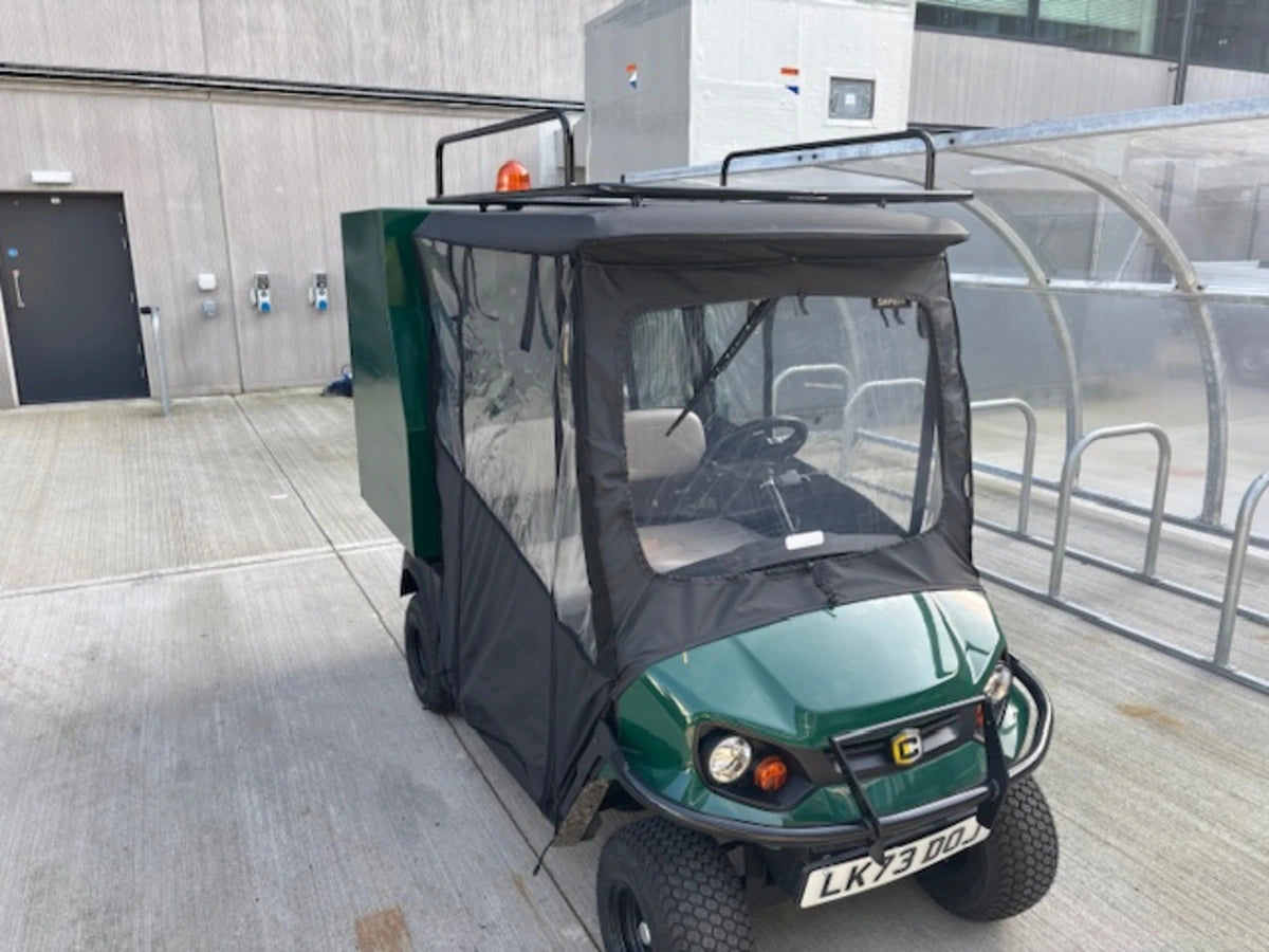 Golf cart outfitted with EZGO-TXT14+VLRCHP-54LRA EZ GO TXT 2014 AND NEWER, VALOR, CUSHMAN HAULER PRO ALUMINUM LADDER RACK on roof, showcasing custom fabrication for golf carts.
