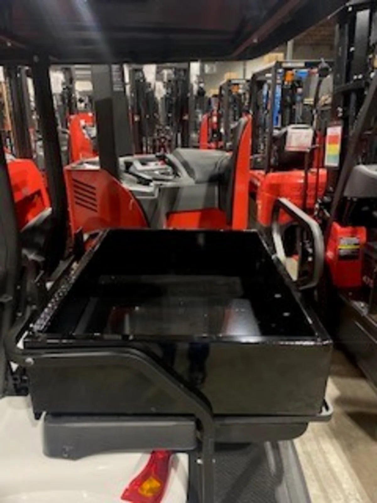 Black heavy-duty utility box installed on a golf cart, showcasing the ICON-I40-RUB31-40WIDE Removable Utility Box Insert for Icon I40 Flip-Seat, custom fabrication for golf carts.