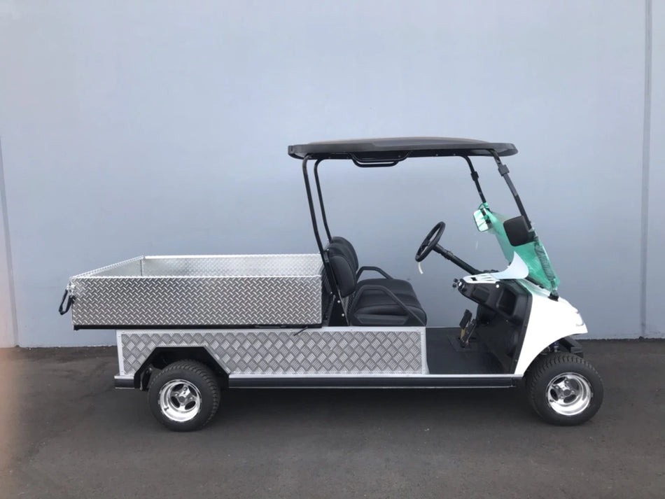 White golf cart equipped with a custom fabricated TBA-48X46X19 ALUMINUM TILT BED FOR GOLF CART, featuring diamond plate flatbed and utility design for cargo and specialty use.