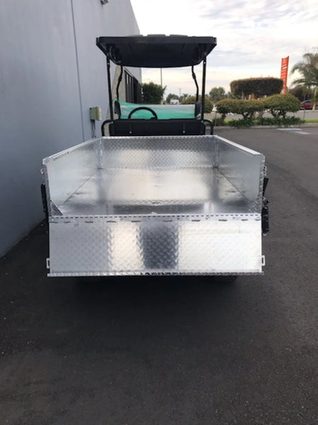 TBA-48X46X19 ALUMINUM TILT BED FOR GOLF CART mounted on a golf cart, showcasing a custom fabrication flatbed designed for cargo and utility hauling.