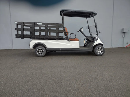 Golf cart equipped with STAKE-SIDES-44X72X24 Flatbed Golf Cart Stake Sides in black, showcasing custom fabrication designed for utility cargo and flatbed specialty golf cart beds.