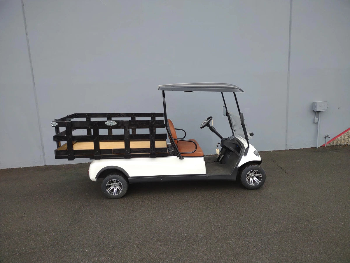 White golf cart equipped with a custom fabricated CRUISE-C20-DECK44X72-W WOOD FLATBED DECK and black railing for cargo transport and utility use.