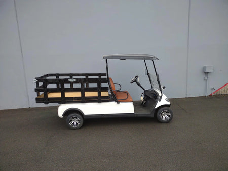 White golf cart equipped with a custom fabricated CRUISE-C20-DECK44X72-W WOOD FLATBED DECK and black railing for cargo transport and utility use.