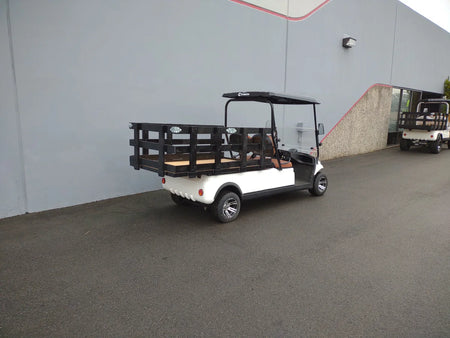 White golf cart equipped with STAKE-SIDES-44X72X24 Flatbed Golf Cart Stake Sides, designed with custom fabrication for versatile cargo and utility transport.