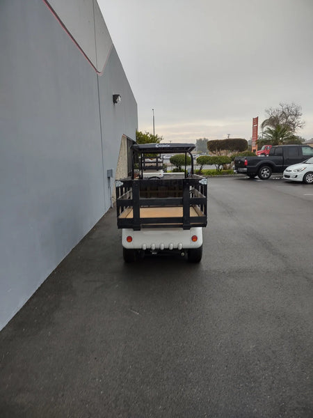 STAKE-SIDES-44X72X24 Flatbed Golf Cart Stake Sides installed on a black flatbed golf cart, showcasing custom fabrication designed for utility cargo and specialty golf cart beds.
