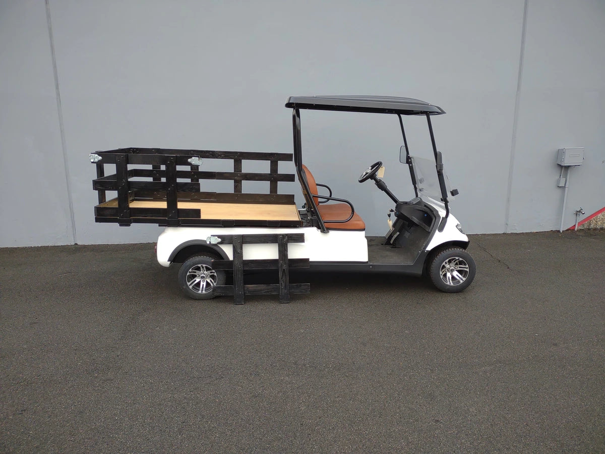 Golf cart equipped with a CRUISE-C20-DECK44X72-W WOOD FLATBED DECK featuring wooden slats and black metal frame, custom fabrication for golf carts enhancing utility and cargo capacity.