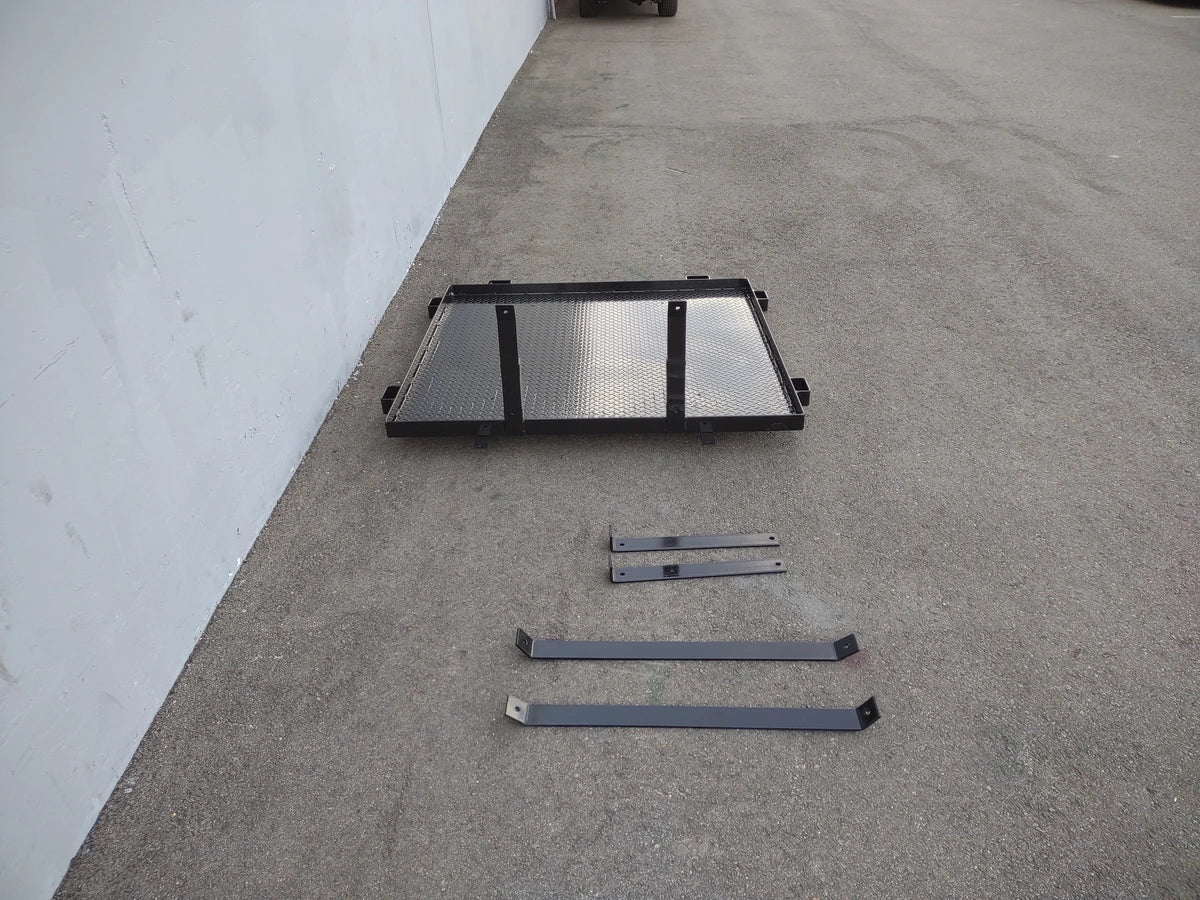 CC-PREC-DECK48X48 SMALL FLATBED DECK with black metal frame and hardware pieces laid out, custom fabrication for golf carts, designed for cargo and utility use.