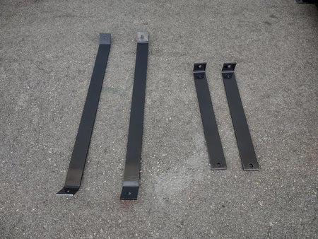 Metal mounting brackets for CC-PREC-DECK48X48 SMALL FLATBED DECK, designed as custom fabrication components for golf carts, shown on a concrete surface.