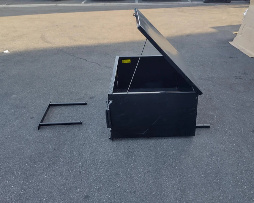 EZGO-RXV-CARGO31 EZ GO RXV HEAVY-DUTY LOCKING CARGO BOX open on pavement showcasing custom fabrication for golf carts with sturdy black metal construction and locking lid.