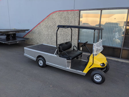 EZGO-TXT-AL-FLAT-72 6 FOOT ALUMINUM BED FLATBED CONVERSION golf cart with a flatbed cargo area, featuring aluminum construction and custom fabrication for golf carts.