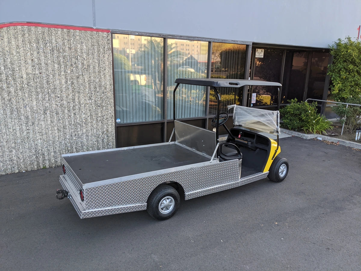 Golf cart featuring custom fabrication with EZGO-TXT-AL-FLAT-72 6 FOOT ALUMINUM BED FLATBED CONVERSION, designed for cargo and utility hauling applications.