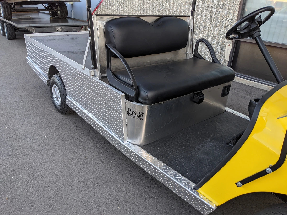 EZGO-TXT-AL-FLAT-72 6 FOOT ALUMINUM BED FLATBED CONVERSION with black padded bench seat and diamond plate aluminum flatbed, custom fabrication for golf carts.