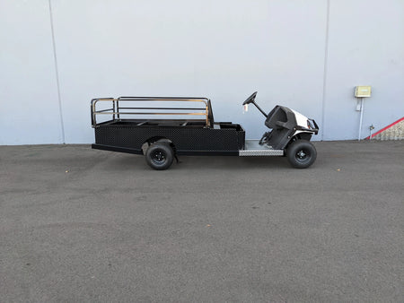CUSH-800-ST-FLAT-72 CUSHMAN HAULER 800 CART STRETCHED INTO 6′ FLATBED featuring custom fabrication with flatbed cargo design and drop rails for utility and specialty golf cart use.