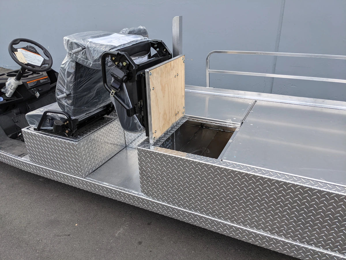 Custom fabrication ambulance conversion for Yamaha Drive golf cart with diamond plate metal surfaces and an open storage compartment, designed as YAM-AMB-3SEAT-96X23 Ambulance Conversion for Yamaha Drive and Drive 2 Golf Cart.