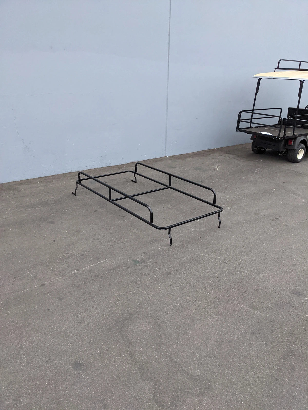 CUSH-SHUTTLE2-84LR CUSHMAN SHUTTLE 2 LADDER RACK custom fabricated black metal ladder rack designed for golf carts, ideal for carrying ladders and cargo accessories.