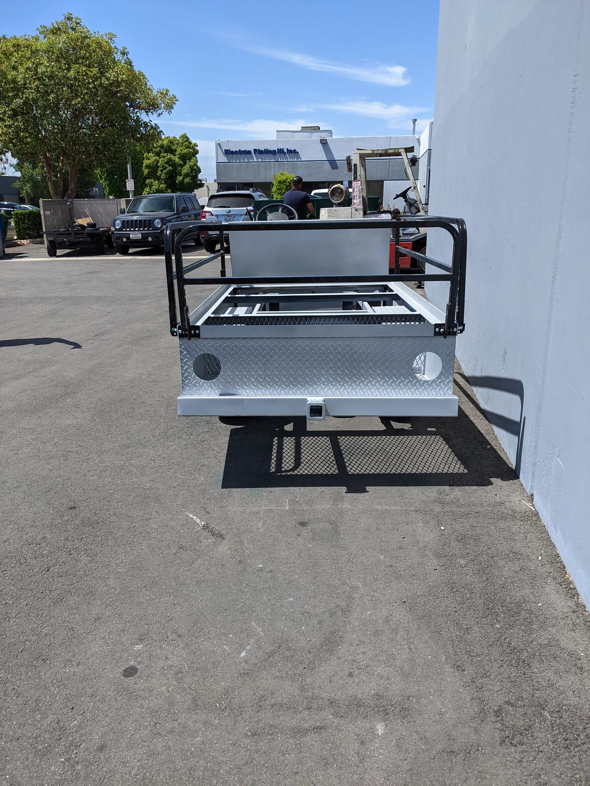EZGO-TXT-ST-FLAT-72 6 FT FLATBED CONVERSION FOR EZ GO TXT custom fabrication with sturdy metal flatbed, black protective railing, designed for golf cart utility and cargo hauling.