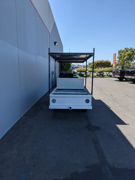 FB-45X120-TLR FLATBED TOP LADDER RACK, 45″ X 120″ WITH REMOVABLE REAR CROSS BAR installed on a flatbed golf cart, custom fabrication for golf carts, suitable for ladders and cargo hauling.