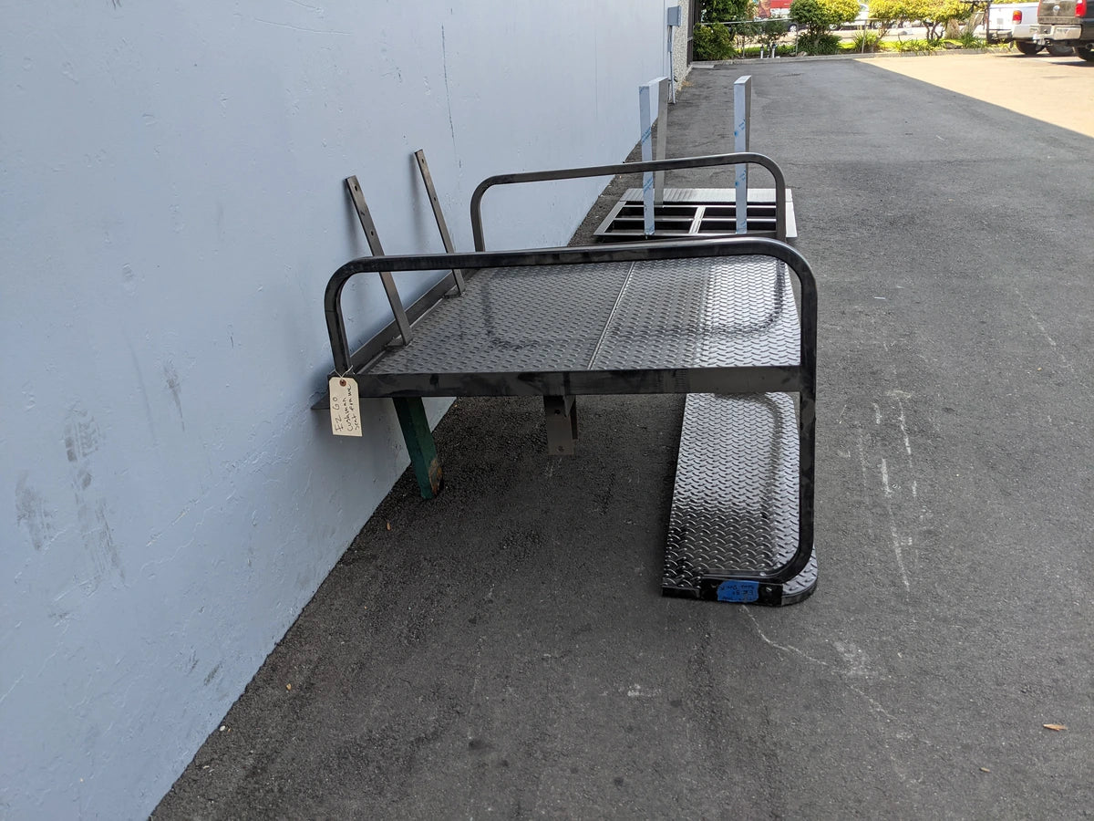 CUSH-800-SB-COMBO CUSHMAN 800 REAR FACING FLIP SEAT FLATBED COMBINATION featuring a custom fabricated black metal flatbed with rear-facing flip seats and side safety rails for utility and cargo use.