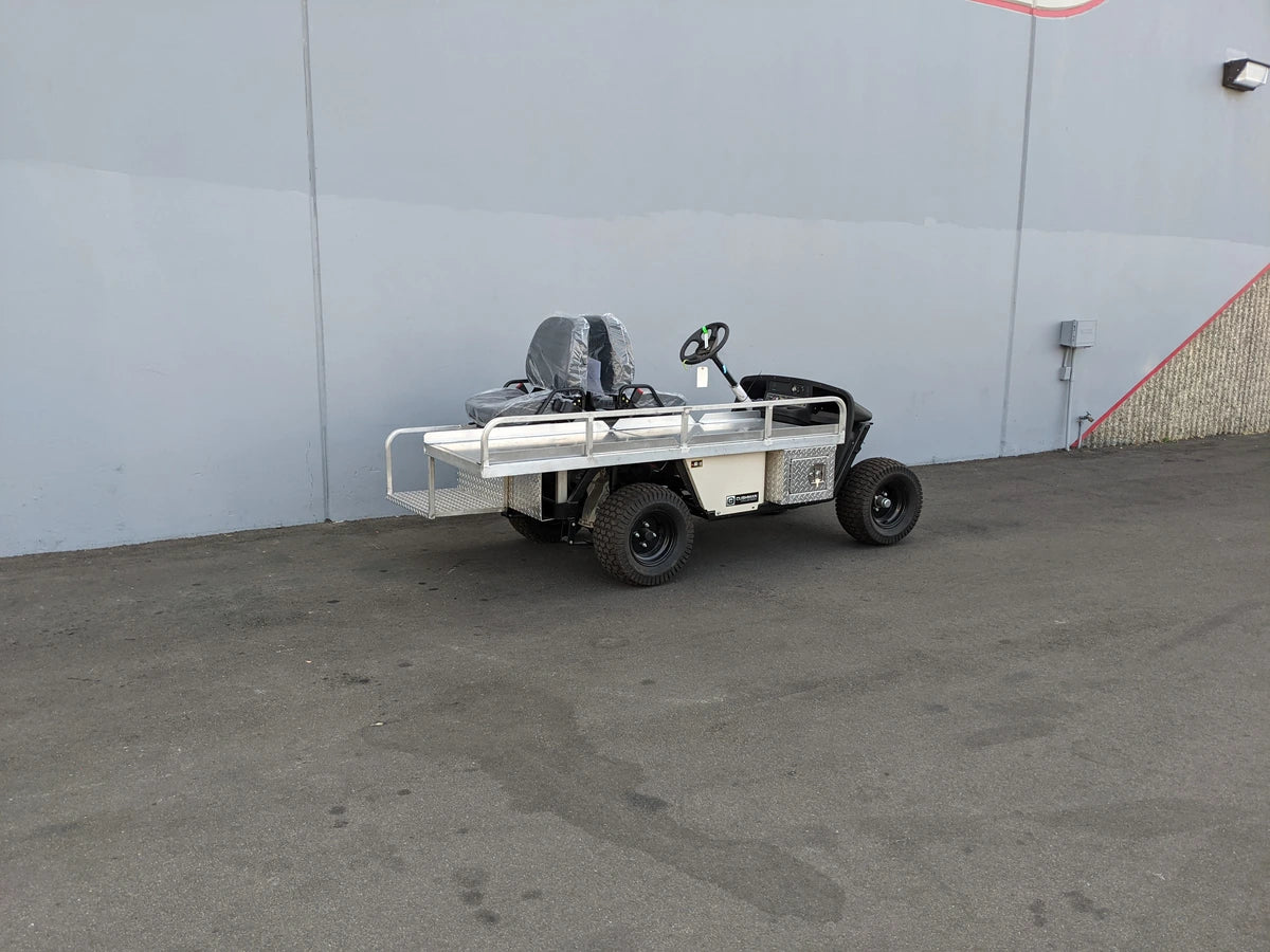 EZGO-EMT-84X24 EMT GOLF CART BED CONVERSION FOR EZ GO TXT GOLF CART showing a custom fabricated flatbed with rails and utility features designed for specialized cargo and medical transport use.