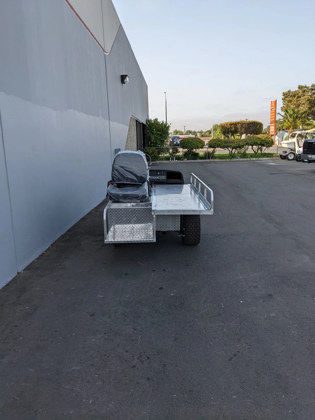 EZGO-EMT-84X24 EMT GOLF CART BED CONVERSION FOR EZ GO TXT GOLF CART featuring custom fabrication with a flatbed design and a single seat, ideal for specialty golf cart beds and utility use.