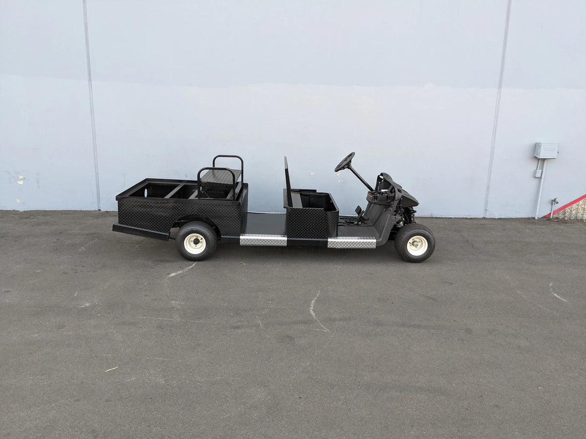 EZGO-RXV-ST-FLAT-CONV-72 EZ GO RXV FLATBED RETROFIT WITH CONVERTIBLE SEAT custom fabrication golf cart with black metal flatbed and convertible seat for cargo and utility use.