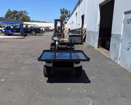 EZGO-TXTVAL-DECK48X48 EZ GO TXT, VALOR, AND MEDALIST DIAMOND PLATE STEEL UTILITY DECK 48″ X 48″ WITH STAKE POCKETS installed on a golf cart, custom fabrication for golf carts, designed for utility cargo and flatbed use.
