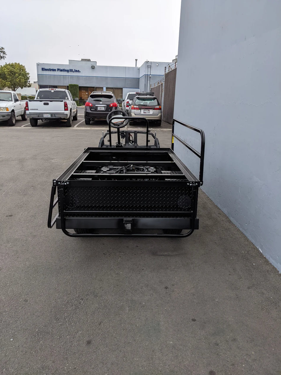 A black custom-fabricated flatbed conversion for golf carts, showing the rear storage and framework of the YAM-DRIVE2-ST-FLAT-72 YAMAHA DRIVE 2 6FT FLATBED CONVERSION.